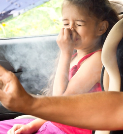 Little girl covered in marijuana smoke