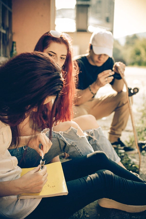 Teenagers rolling drugs