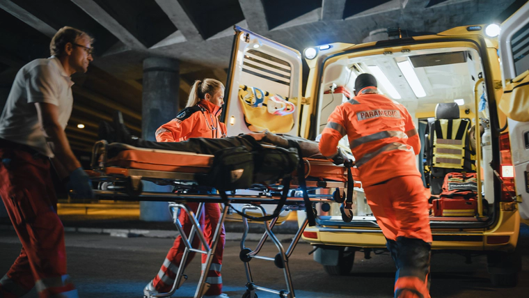 Paramedics taking a marijuana user to the ambulance