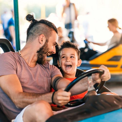 Dad with son drives an electric car