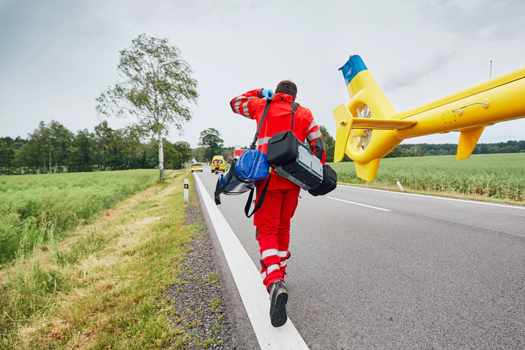 Paramedic is jumping off helicopter 