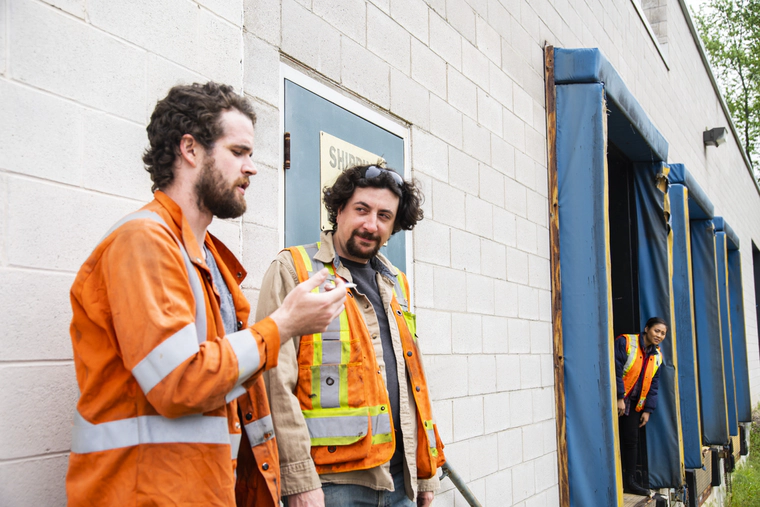 Two workers smoke marijuana