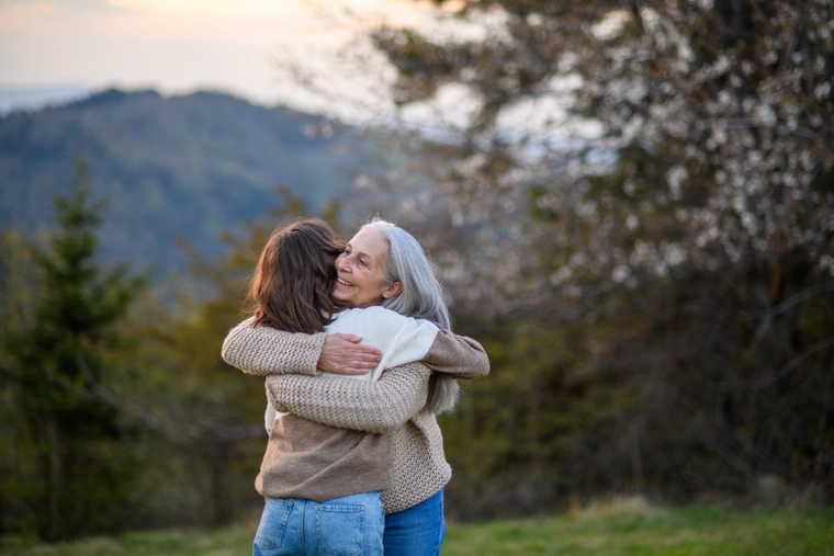 Grandmother hugs granddaughter