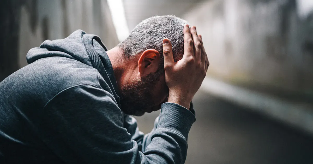 Man with his head in his hands